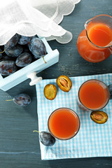 Plum Juice in a glasses with fresh fruits