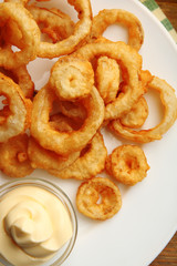 Chips rings with sauce on plate