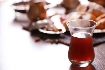 Antique tea-set with Turkish delight and baking on table close-up