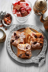 Antique tea-set with Turkish delight and baking on table close-up