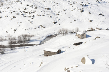 Isolated mountain hut in the snow