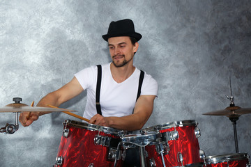 Fototapeta na wymiar Musician playing the drums in a studio