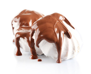 Chocolate poured on marshmallow isolated on white
