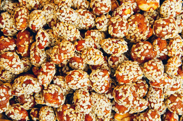 Peanuts in caramel with sesame seeds 