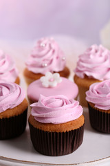Tasty cupcakes on stand, close-up