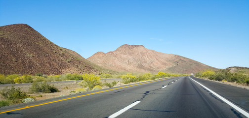 Driving on Interstate-10 near city of Quartzsite in Arizona mountain desert