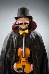 Funny violin player wearing tophat