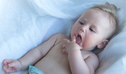 Toddler playing with pacifier