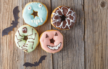 Halloween donuts on wooden table