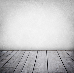 Grunge wall and wood paneled floor, interior of a room.
