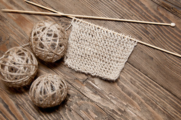 beige knitting and clew