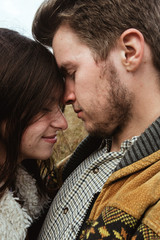 stylish beautiful traveling tender happy couple in the mountains