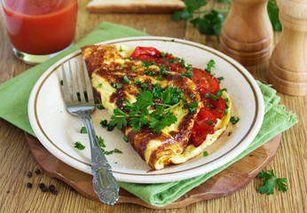 Breakfast omelet with tomatoes.