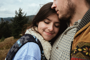 stylish beautiful traveling tender happy couple in the mountains