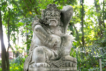 Fototapeta na wymiar Stutue in Sacred Monkey Forest, Ubud, Bali, Indonesia