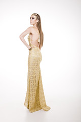 Pretty model wearing a yellow gala dress