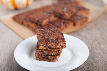 Flourless healthy pumpkin brownies with chocolate chips, selective focus