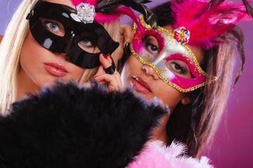 Two women with carnival venetian masks