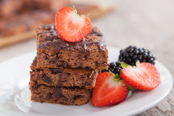 Flourless healthy pumpkin brownies with chocolate chips, selective focus