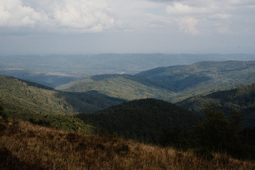 Fototapeta premium beautiful amazing landscape of sunny mountains, forest, sky and