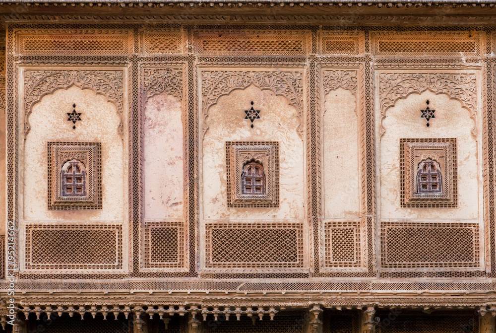 Wall mural six-pointed star and the other symbols on the ancient wall of the estate in india