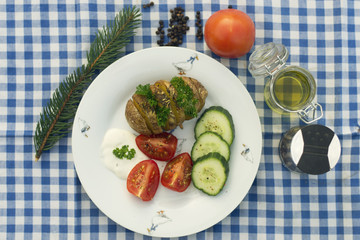a baked potatoe with vegetables