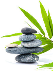 Fototapeta na wymiar The stacked of Stones spa treatment scene and bamboo leaves with