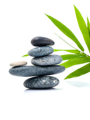 Fototapeta na wymiar The stacked of Stones spa treatment scene and bamboo leaves with