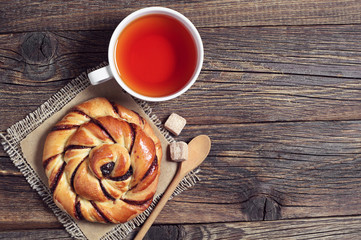 Tea cup and sweet bun