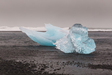 Icebergs from glaciers washed up on the black beach. Iceland