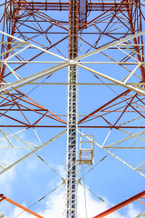 Telecommunication tower with the blue sky.