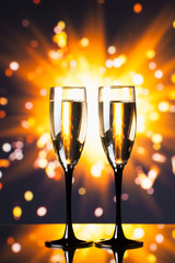 champagne glass against sparkler background