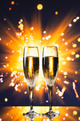 champagne glass against sparkler background