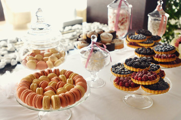 beautiful delicious stylish macaroons and fruit pies and cupcake