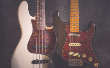 Worn vintage electric guitar and bass