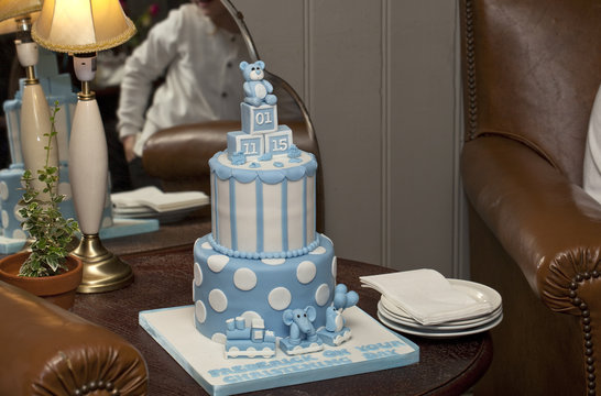 Christening Cake. A blue and white cake is presented for the christening of a young boy.