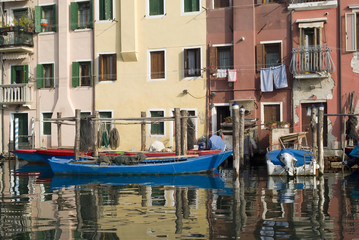 Fototapeta na wymiar Italy, Province of Venice. Colourful ancient houses in Chioggia