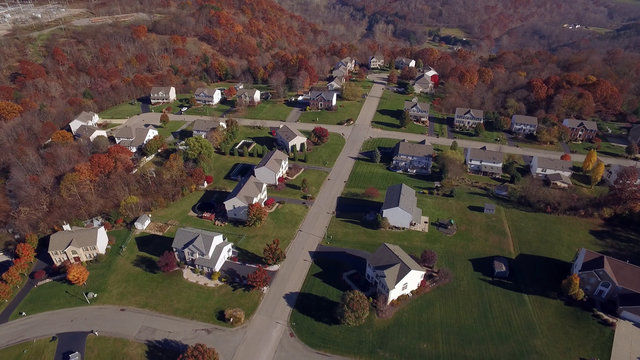An aerial shot of a typical western Pennsylvania residential neighborhood in late Autumn.	