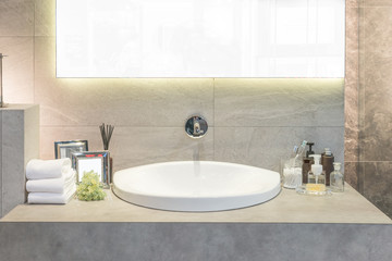 Washbasin with towel and decoration in bathroom