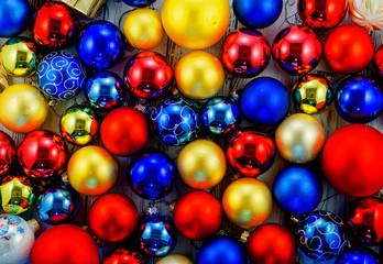 Fototapeta na wymiar Background of colored Christmas tree balls and decorations