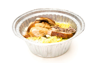 round shape lunch box of chicken slices on white with clipping path