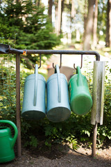 Watering cans at Skogskyrkogården garden cemetery in Stockholm, Sweden