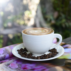 hot coffee, smoke on surface coffee mugs  ,cup of coffee on magazine.
