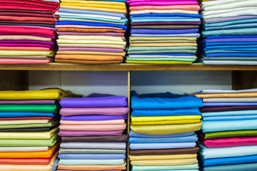 Colorful of fabric satin rolls.