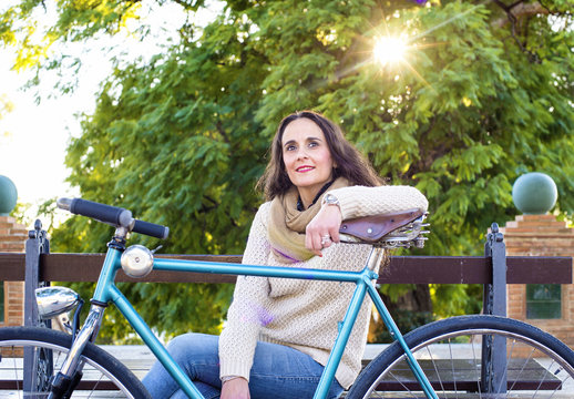 Adult woman with vintage bike