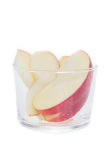 Fresh apple slice in glass cup isolated on white background