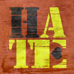 hate design with black heart on wood grain texture