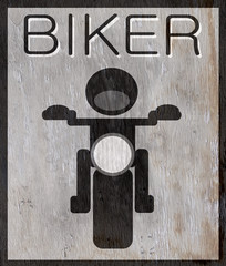 biker sign with wood grain texture