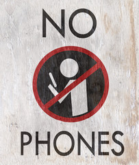 no phones sign on wood grain texture © jdoms