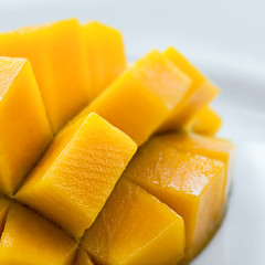 Mango diced on the skin closeup square composition
